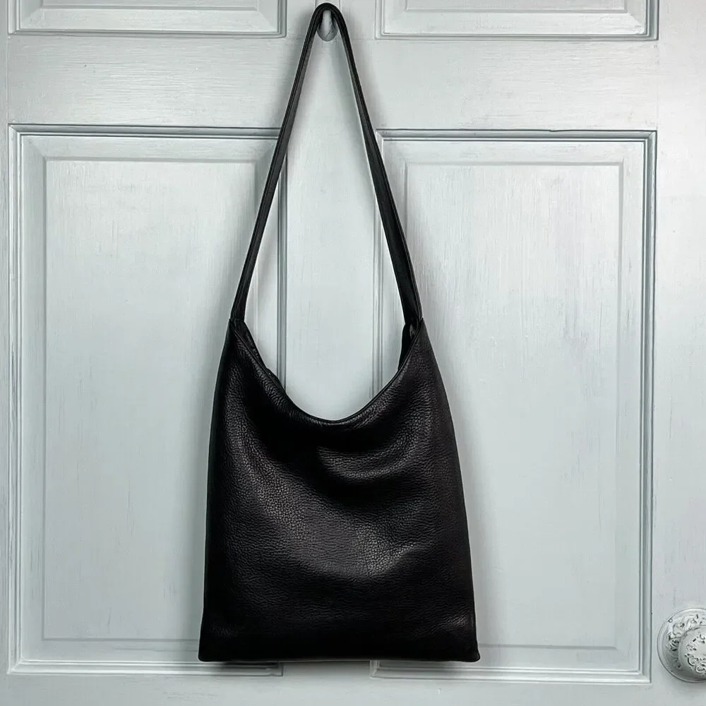 The Sak Hobo Shoulder Bag Pebbled Black Leather Pockets Signature Charm Roomy